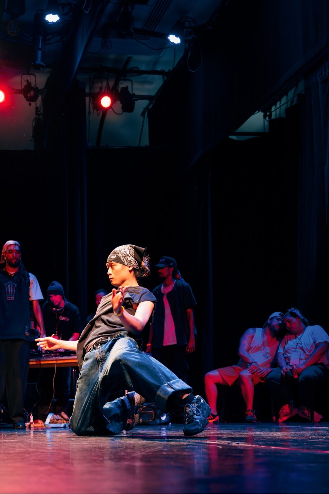 B-boy mid-move, red light